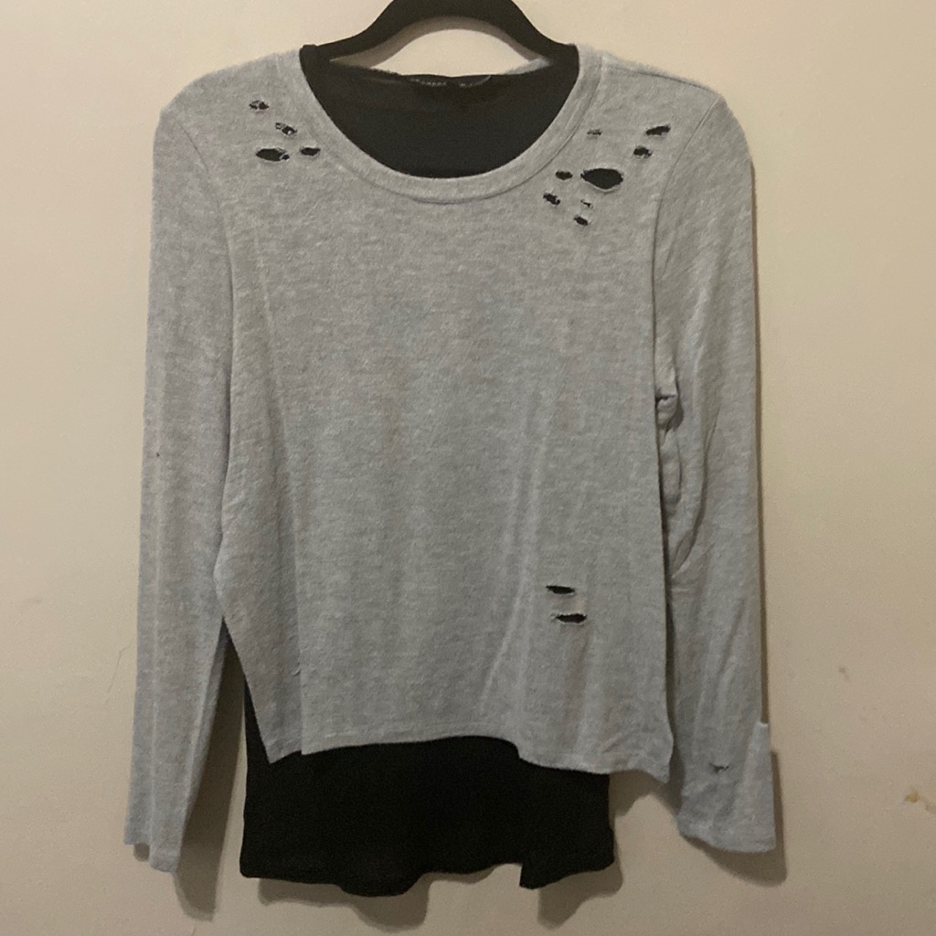 Ripped Long Sleeve Jn Very Good Condition .